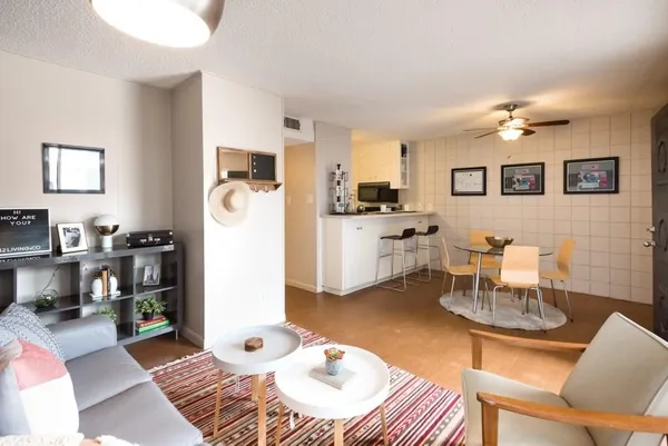 a living room with furniture and a table