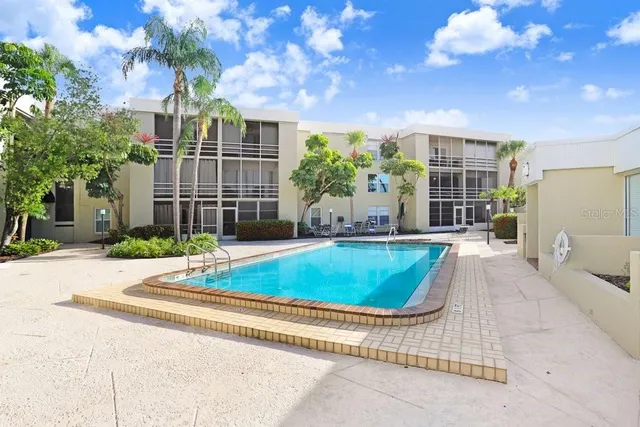 a view of a house with basketball court