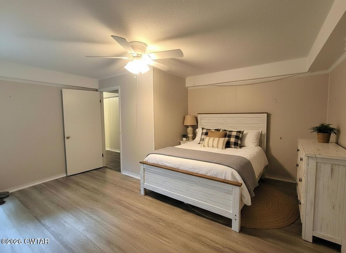 513 Viar Road Dyersburg, TN 38024 - Photo 35 of 37 a bedroom with a bed and a ceiling fan