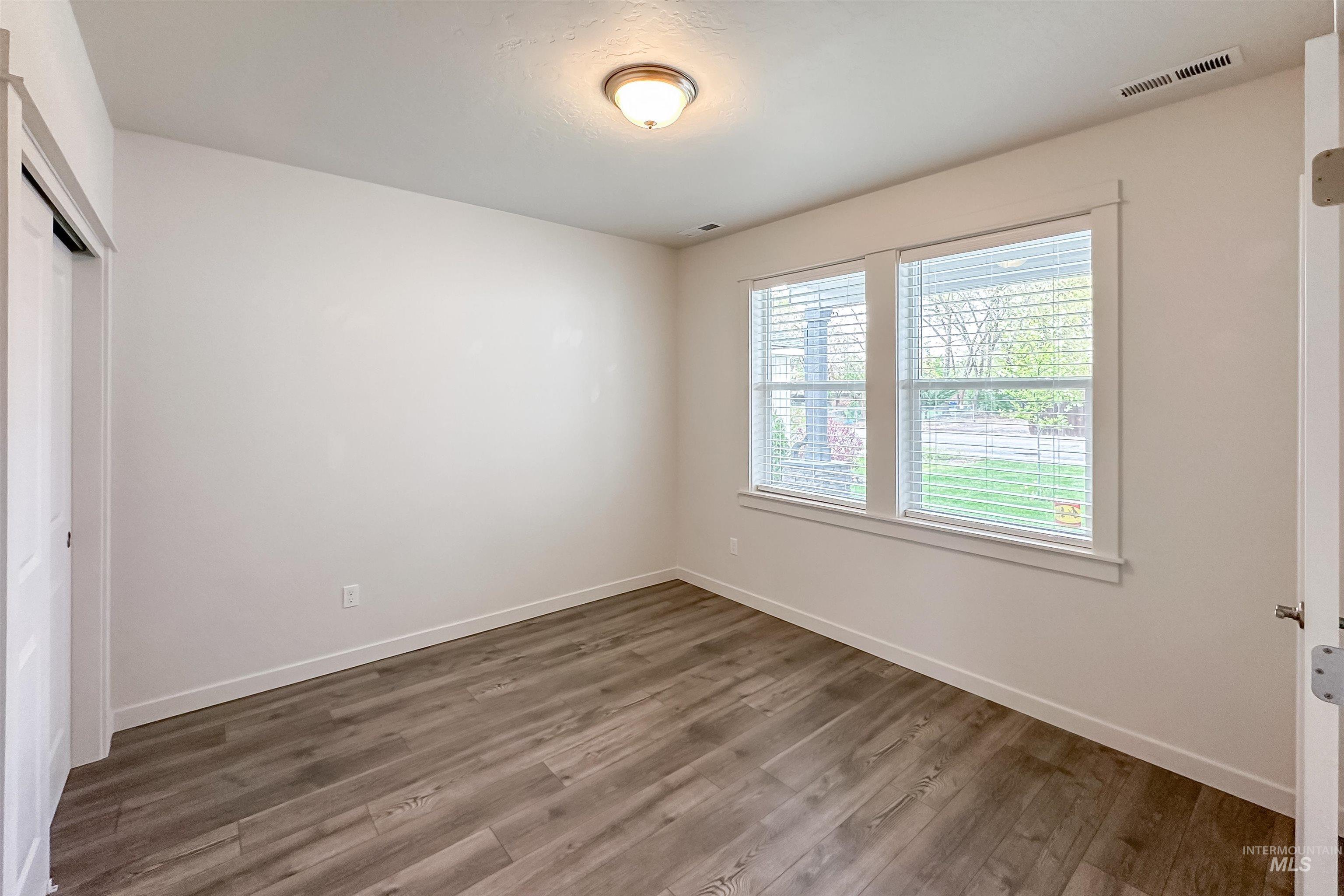 9687 West Arnold Road Boise, ID 83714 - Photo 14 of 37 Wood-finish flooring with white trim