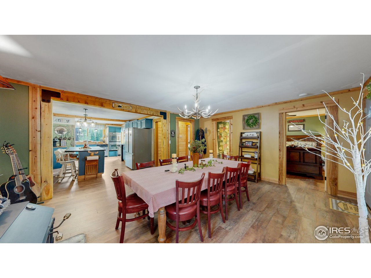 2420 Big Owl Road Allenspark, CO 80510 - Photo 5 of 26 Dining area with fireplace