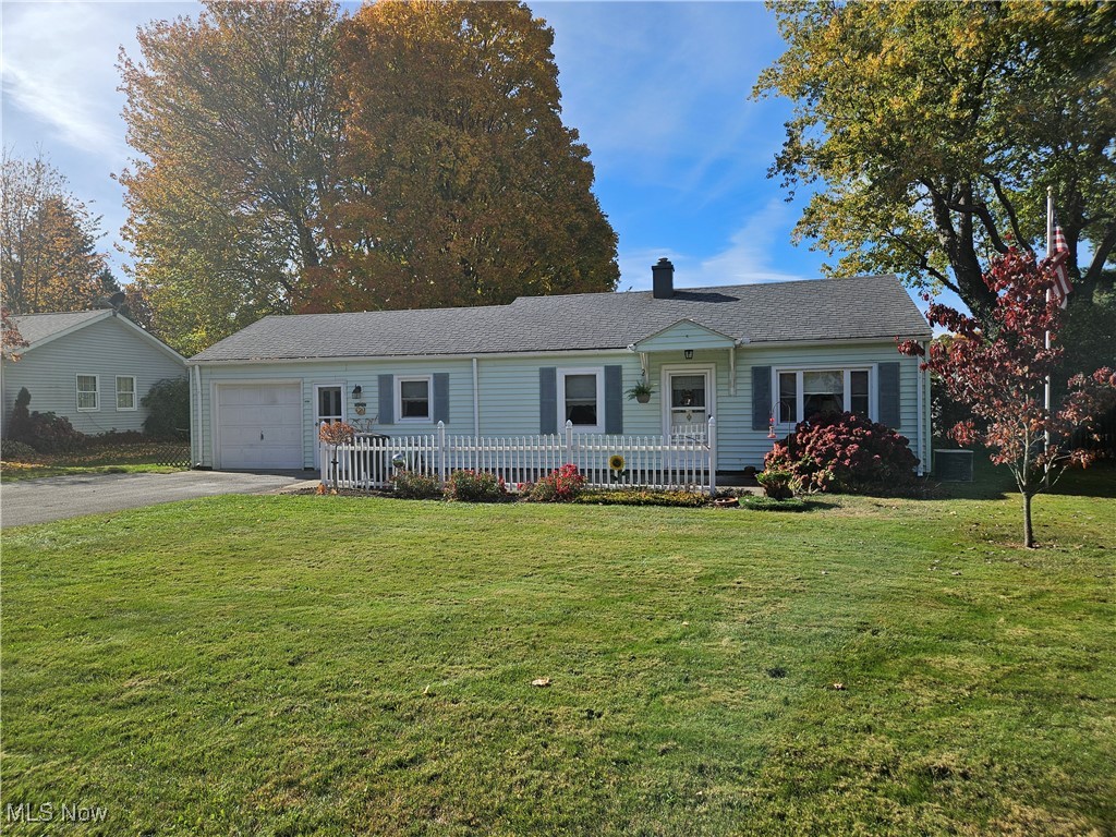 1914 Sandgate Road Madison, OH 44057 - Photo 1 of 13 Ranch-style house featuring a front yard and a garage