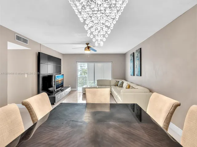 a kitchen with stainless steel appliances granite countertop a refrigerator sink and cabinets