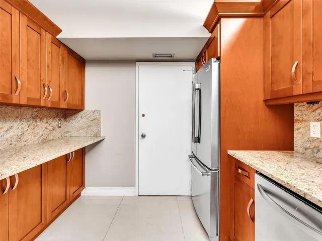 a living room with furniture ceiling fan and a window