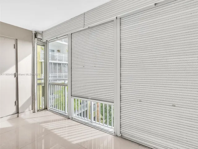 a living room with furniture and a ceiling fan