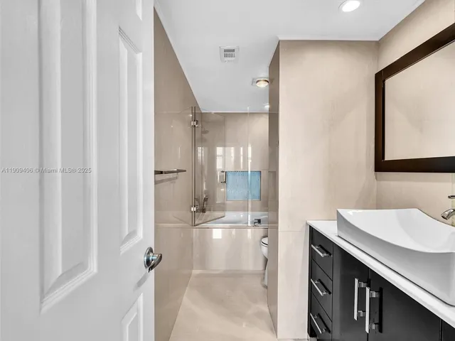 a view of a livingroom with a book shelf