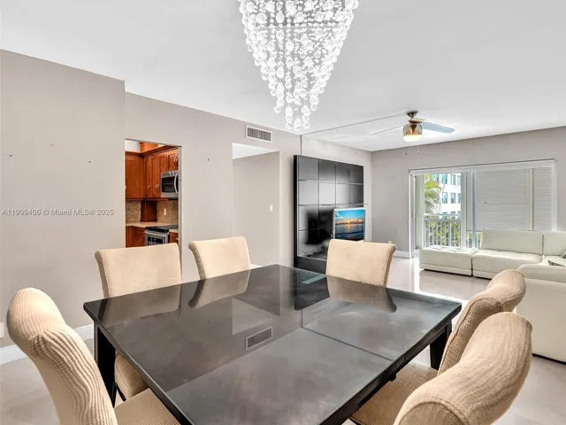 a kitchen with stainless steel appliances granite countertop a stove and a microwave