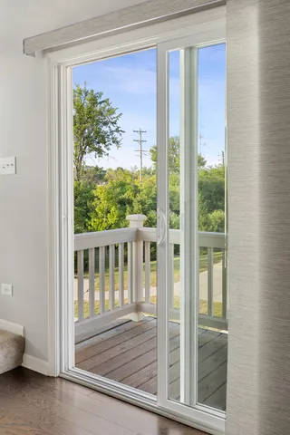 a view of a porch with a floor to ceiling window