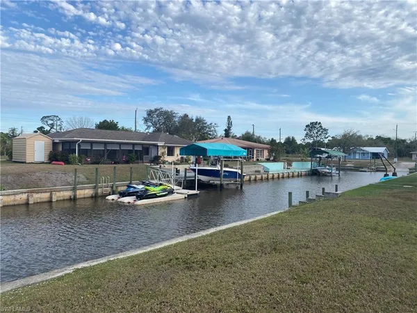a view of a lake with couches and city view
