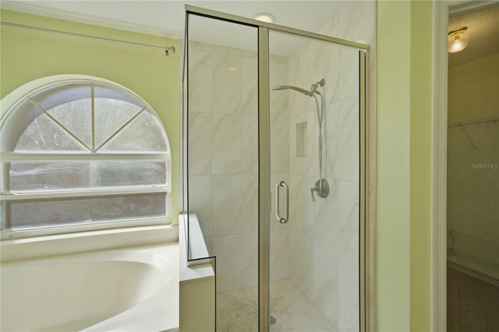 632 Blenheim Loop Winter Springs, FL 32708 - Photo 14 of 55 a bathroom with a glass door shower and a sink