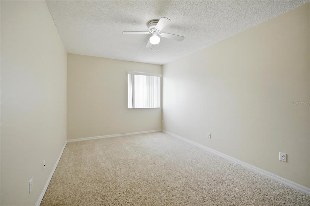 632 Blenheim Loop Winter Springs, FL 32708 - Photo 18 of 55 an empty room with windows and ceiling fan