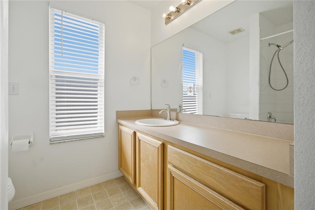 632 Blenheim Loop Winter Springs, FL 32708 - Photo 22 of 55 a bathroom with a granite countertop sink and a mirror