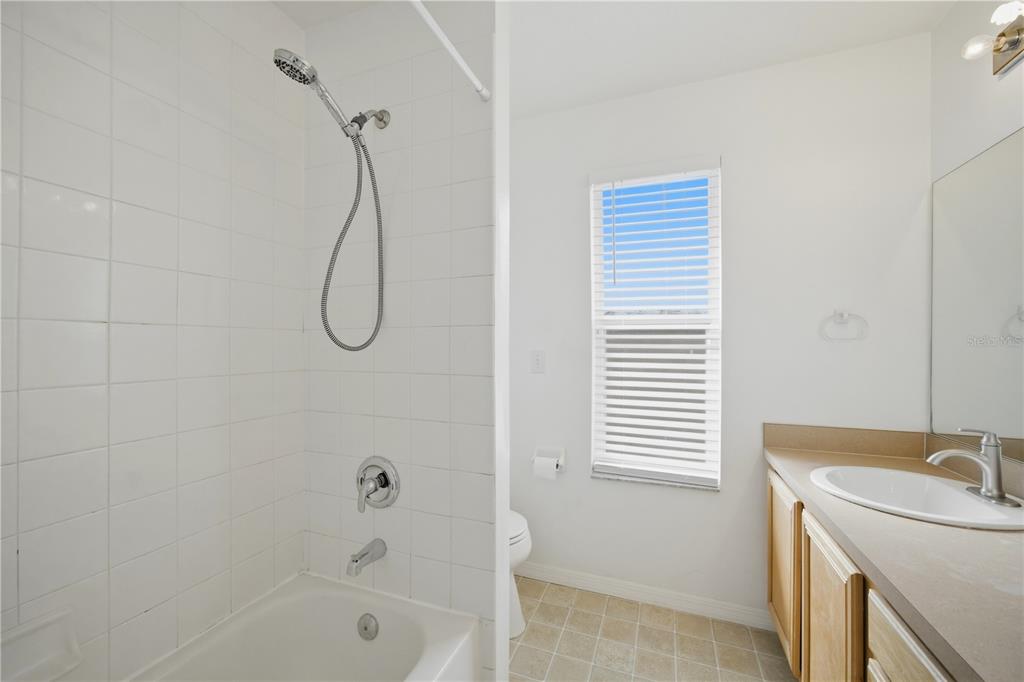 632 Blenheim Loop Winter Springs, FL 32708 - Photo 24 of 55 a bathroom with a bath tub with a shower