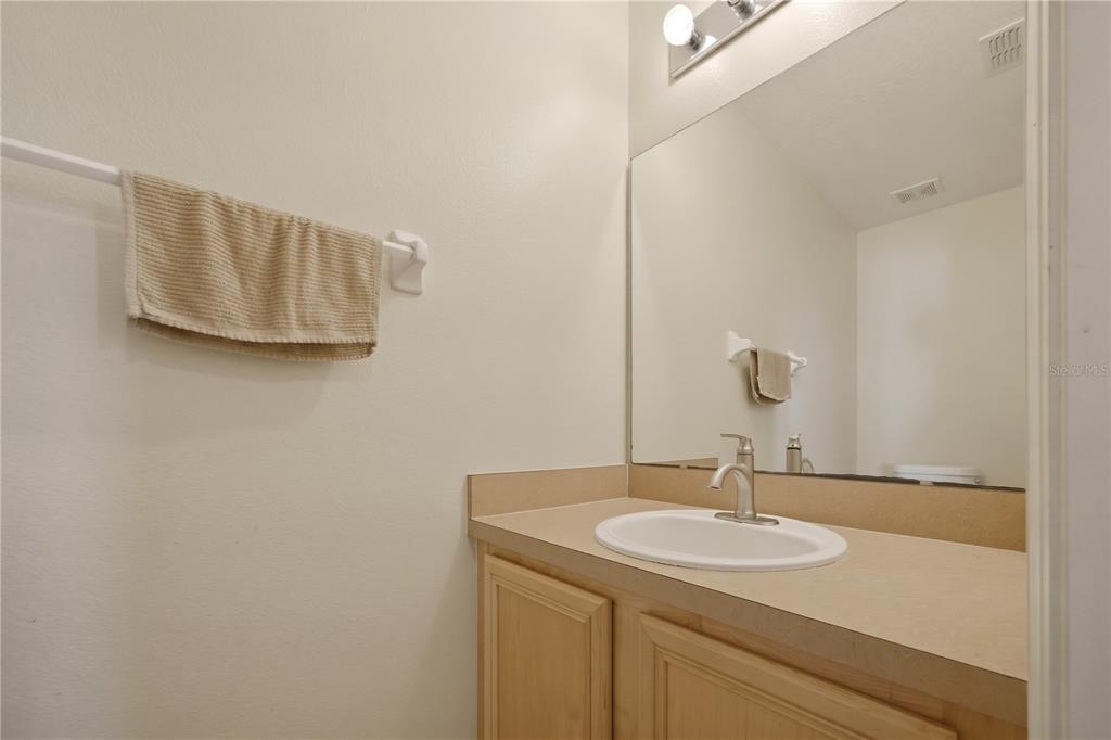 632 Blenheim Loop Winter Springs, FL 32708 - Photo 25 of 55 a bathroom with a sink and a mirror