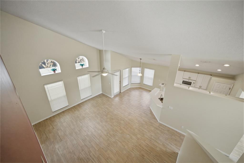 632 Blenheim Loop Winter Springs, FL 32708 - Photo 27 of 55 a view of a refrigerator in kitchen and windows
