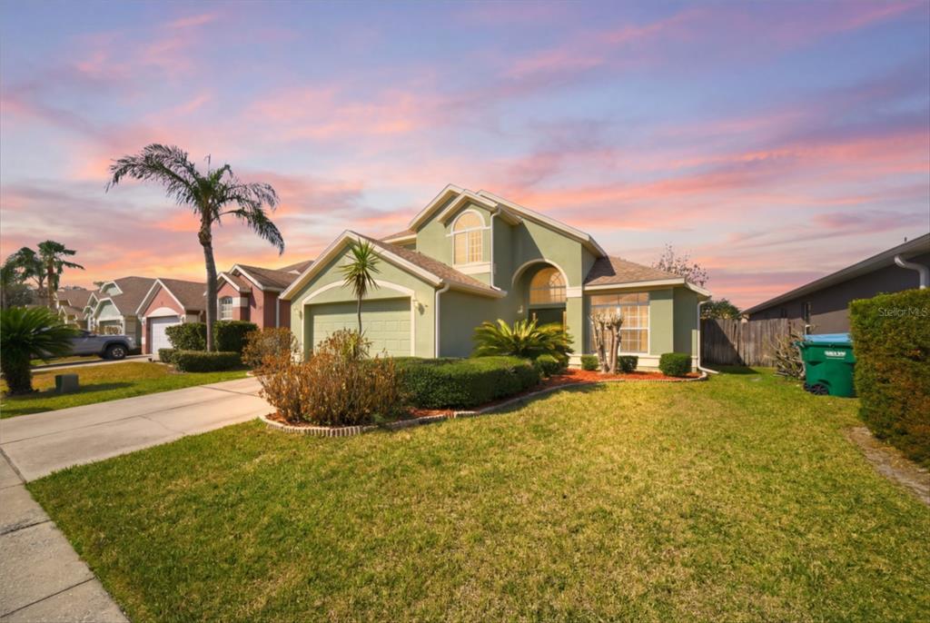 632 Blenheim Loop Winter Springs, FL 32708 - Photo 3 of 55 a front view of a house with a yard