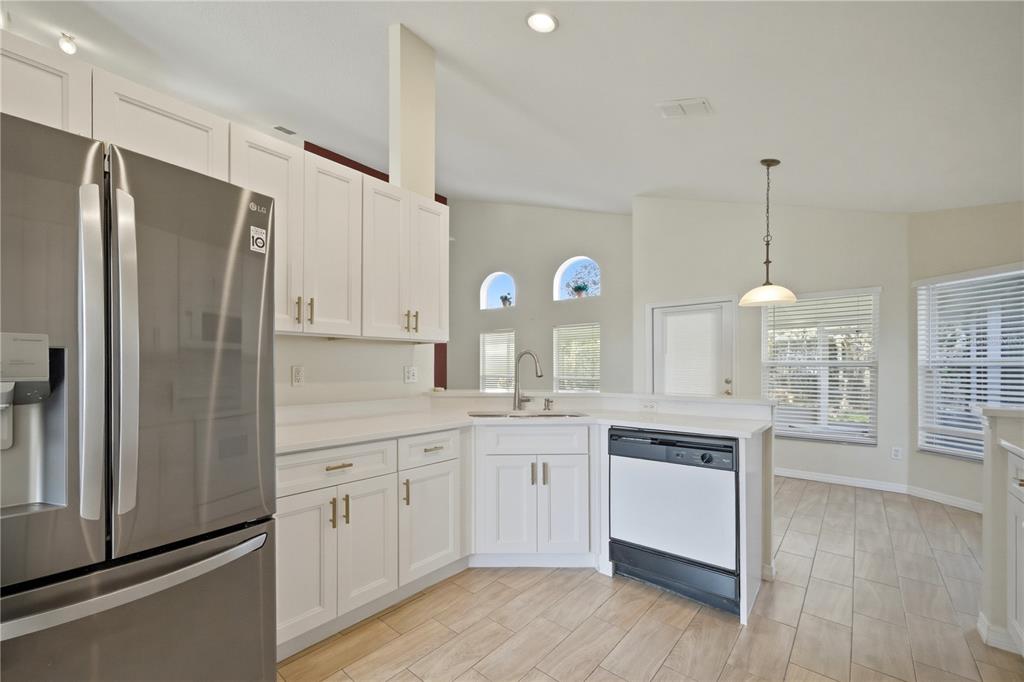 632 Blenheim Loop Winter Springs, FL 32708 - Photo 31 of 55 a kitchen with a refrigerator and a sink