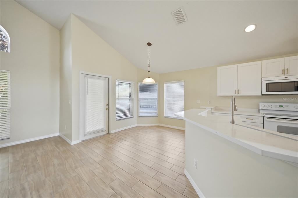 632 Blenheim Loop Winter Springs, FL 32708 - Photo 33 of 55 a view of a kitchen center island and stainless steel appliances