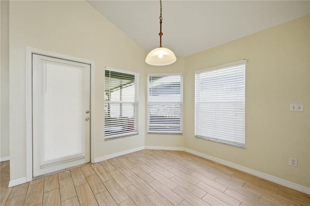 632 Blenheim Loop Winter Springs, FL 32708 - Photo 34 of 55 a view of an empty room with a window and wooden floor