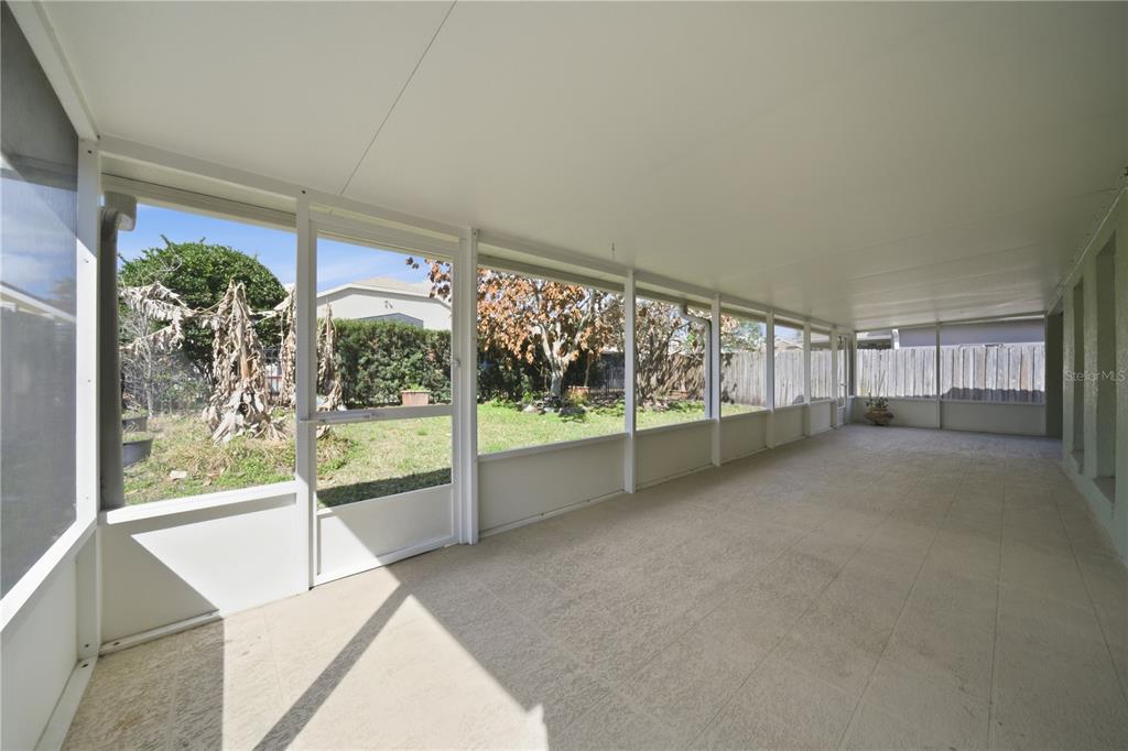 632 Blenheim Loop Winter Springs, FL 32708 - Photo 44 of 55 a view of empty room with floor to ceiling window and an outdoor view