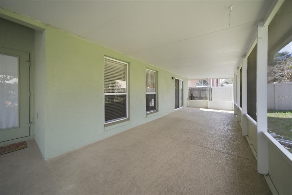 632 Blenheim Loop Winter Springs, FL 32708 - Photo 48 of 55 a view of a big room with windows and chandelier