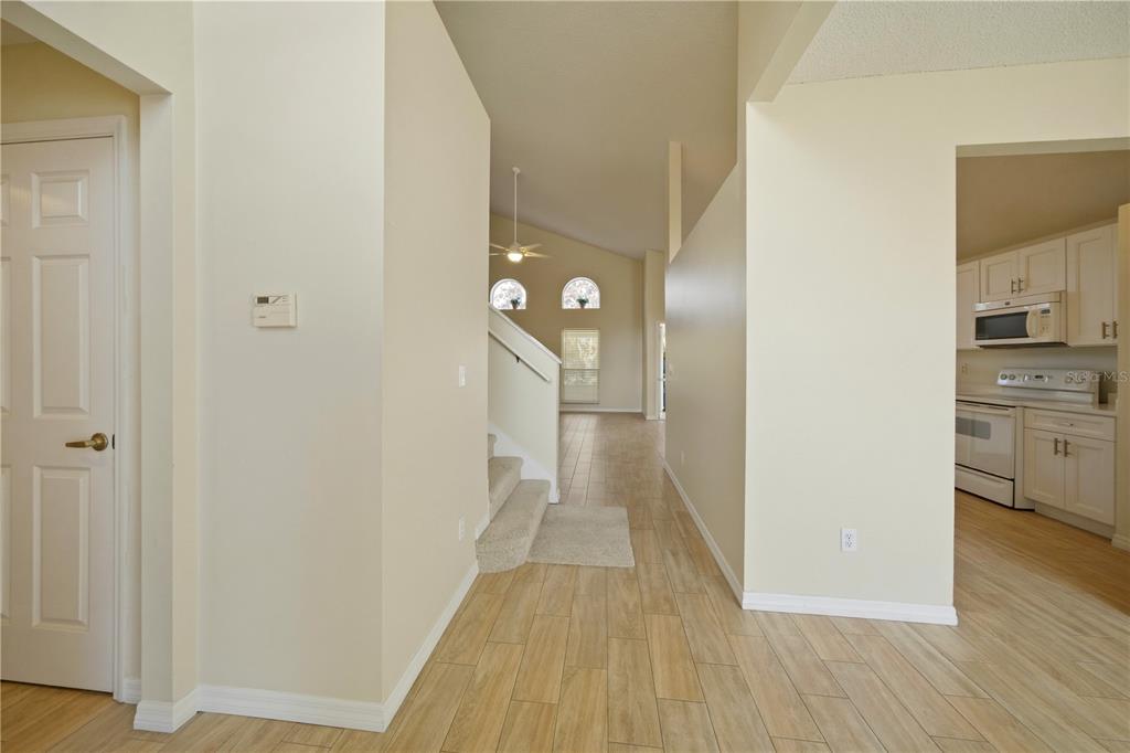 632 Blenheim Loop Winter Springs, FL 32708 - Photo 5 of 55 a view of a hallway with wooden floor
