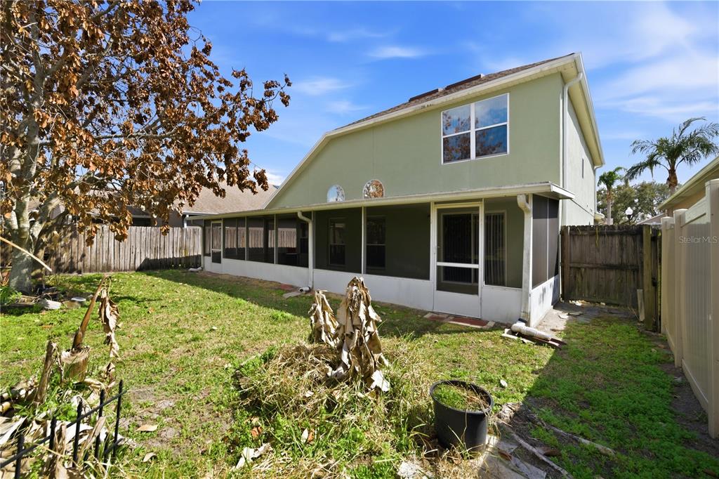 632 Blenheim Loop Winter Springs, FL 32708 - Photo 51 of 55 a front view of a house with a yard table and chairs