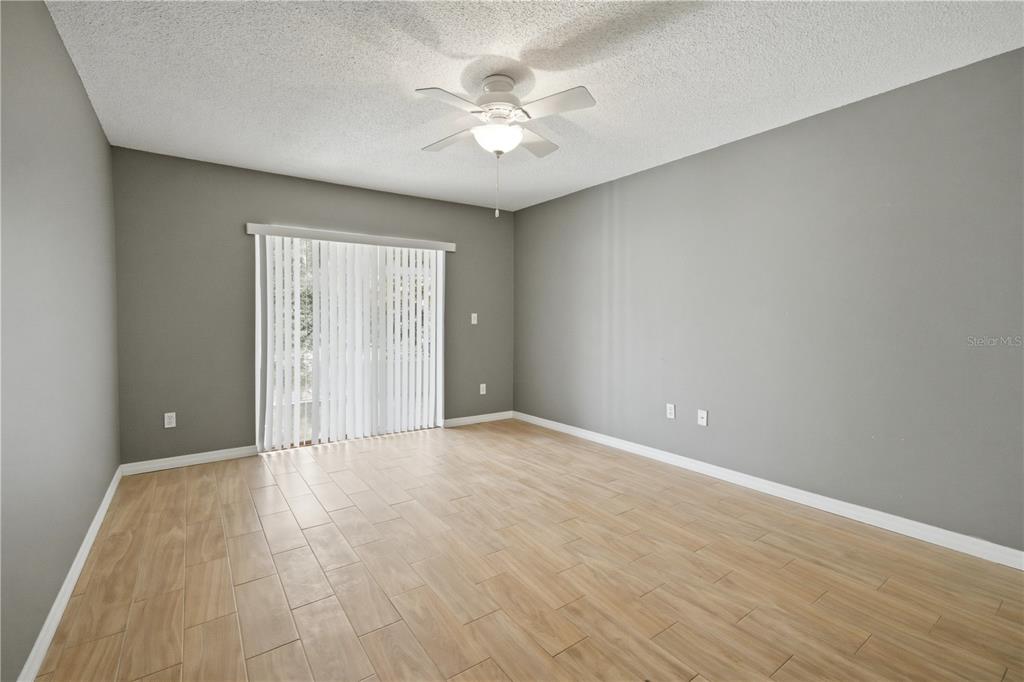 632 Blenheim Loop Winter Springs, FL 32708 - Photo 6 of 55 a view of an empty room with a window