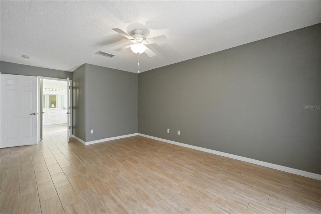 632 Blenheim Loop Winter Springs, FL 32708 - Photo 7 of 55 a view of an empty room with wooden floor