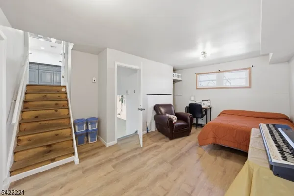 a living room with furniture a rug and a large window