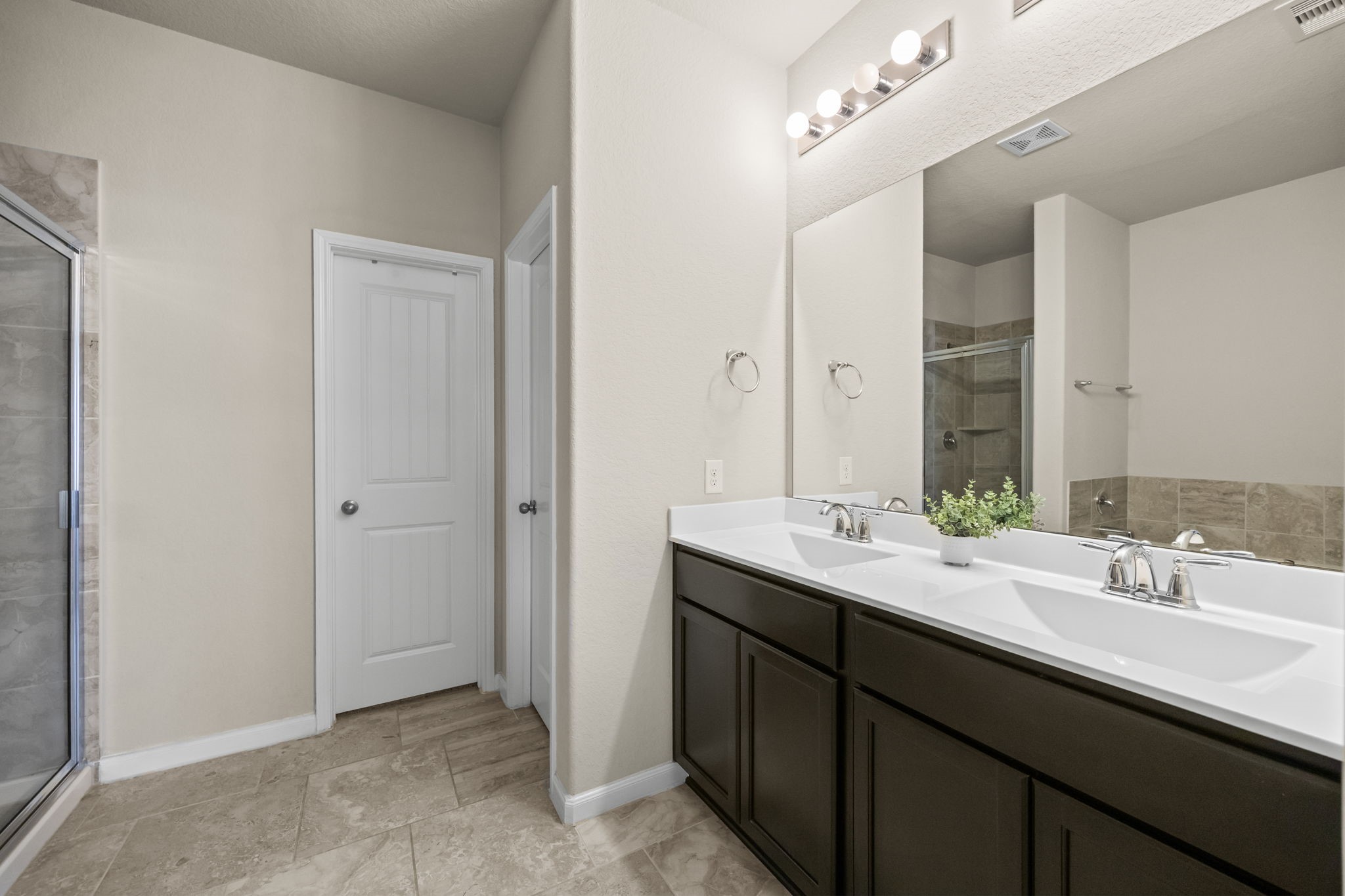 519 Yellow Bullhead Court Rosenberg, TX 77469 - Photo 11 of 24 a bathroom with a double vanity sink and mirror