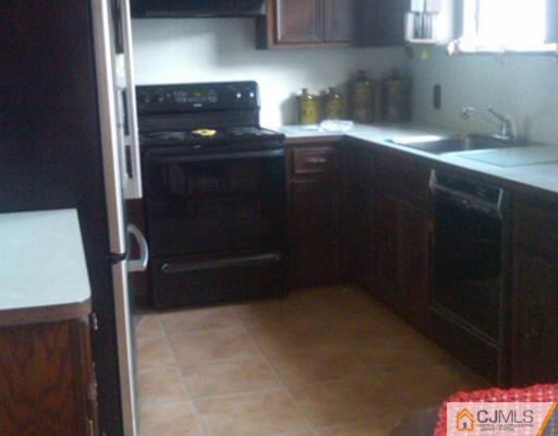 19 Old Post Road Edison, NJ 08817 - Photo 3 of 22 a kitchen with a sink and cabinets