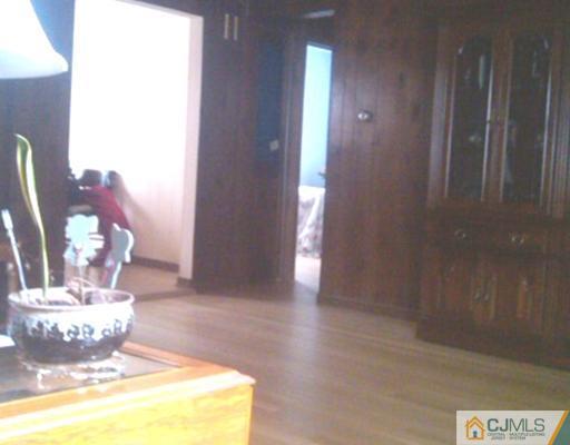 19 Old Post Road Edison, NJ 08817 - Photo 7 of 22 a view of a hallway with wooden floor