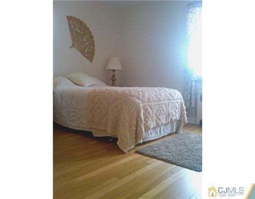 19 Old Post Road Edison, NJ 08817 - Photo 9 of 22 a bedroom with a bed and a window
