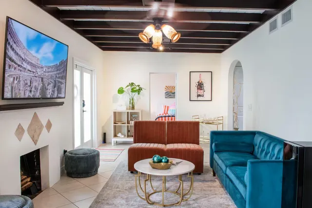 a living room with furniture and a fireplace