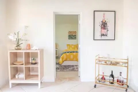 a en suite bathroom with a double vanity sink and a mirror