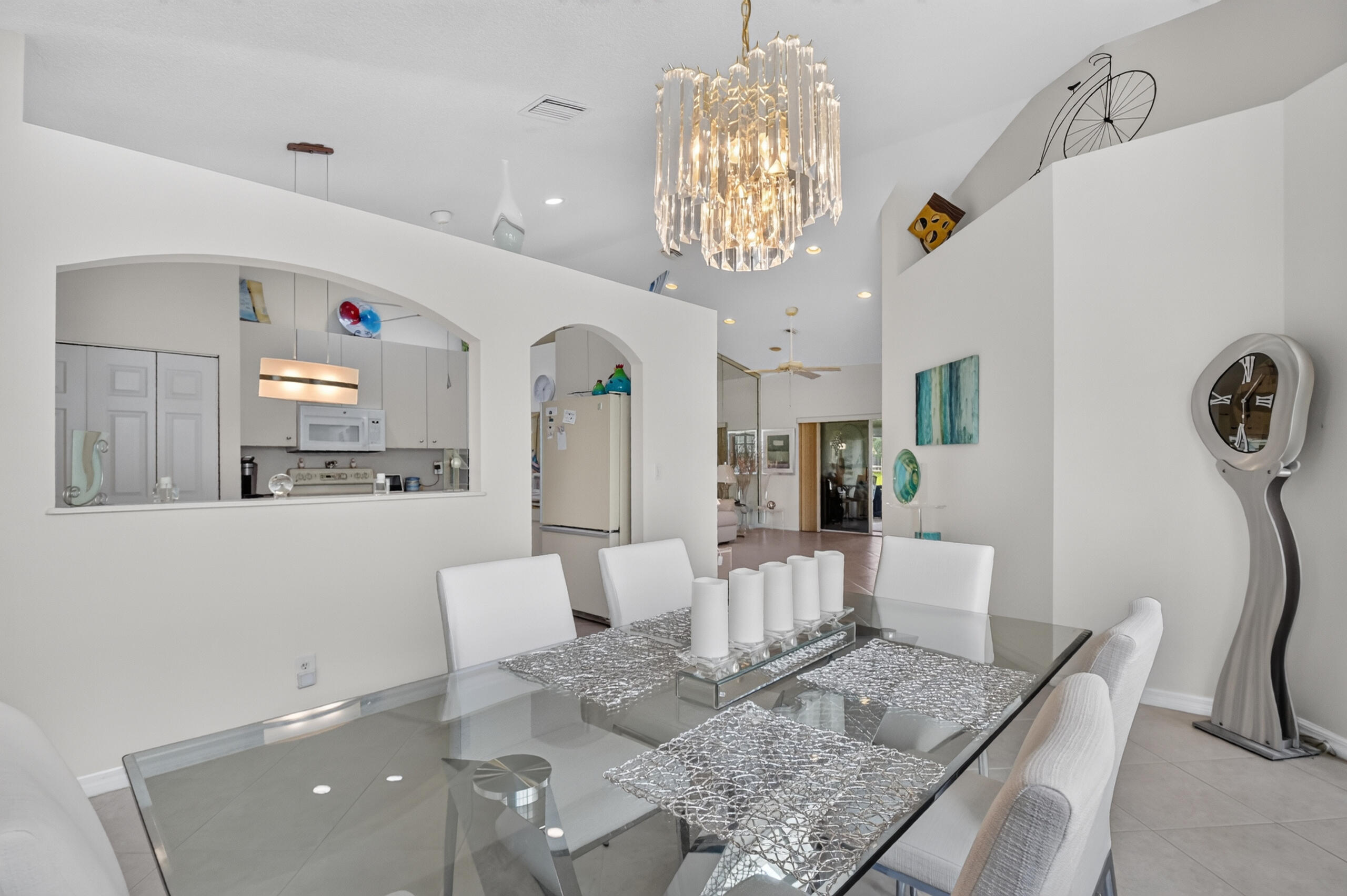 15340 Floral Club Road Delray Beach, FL 33484 - Photo 7 of 42 a living room with furniture and a chandelier