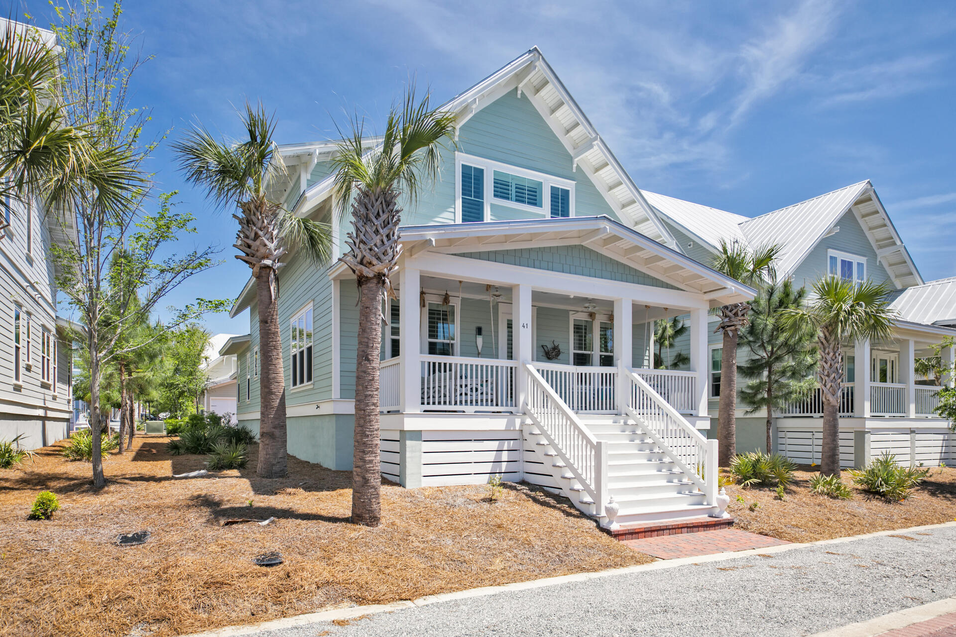 41 Clipper Street Inlet Beach, FL 32461 - Photo 1 of 48 a view of a white house with large windows and a tree