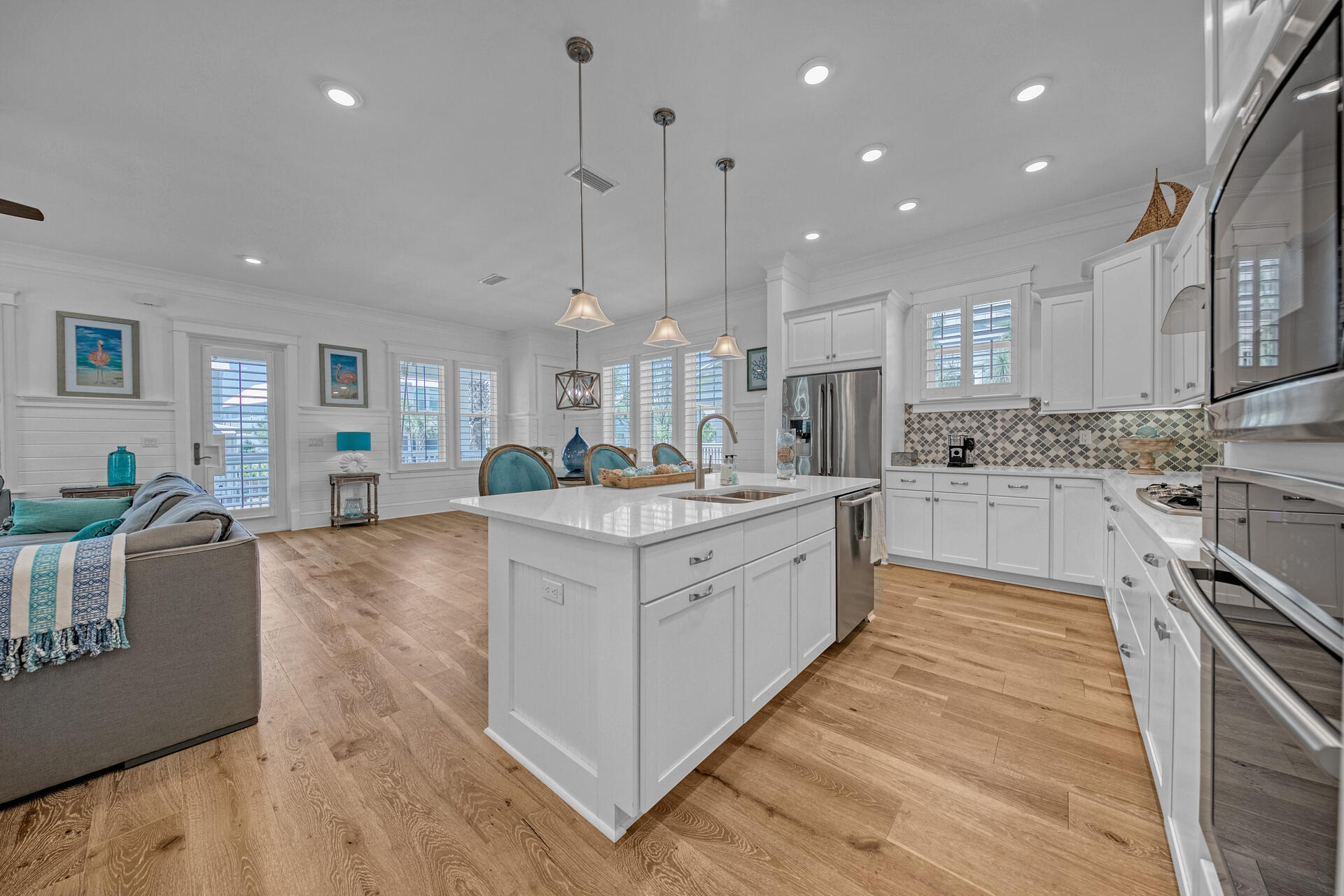 41 Clipper Street Inlet Beach, FL 32461 - Photo 16 of 48 a large kitchen with stainless steel appliances kitchen island granite countertop a large counter top a stove a sink and a cabinets