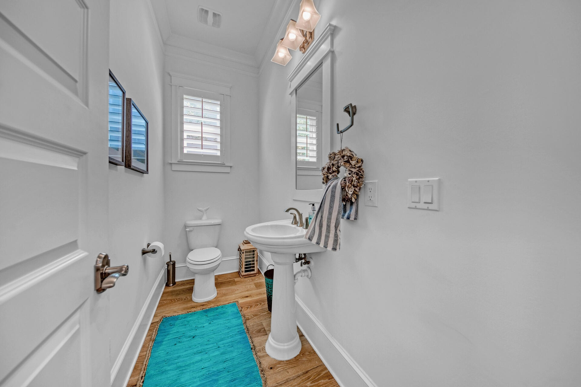 41 Clipper Street Inlet Beach, FL 32461 - Photo 17 of 48 a bathroom with a sink a toilet and a mirror