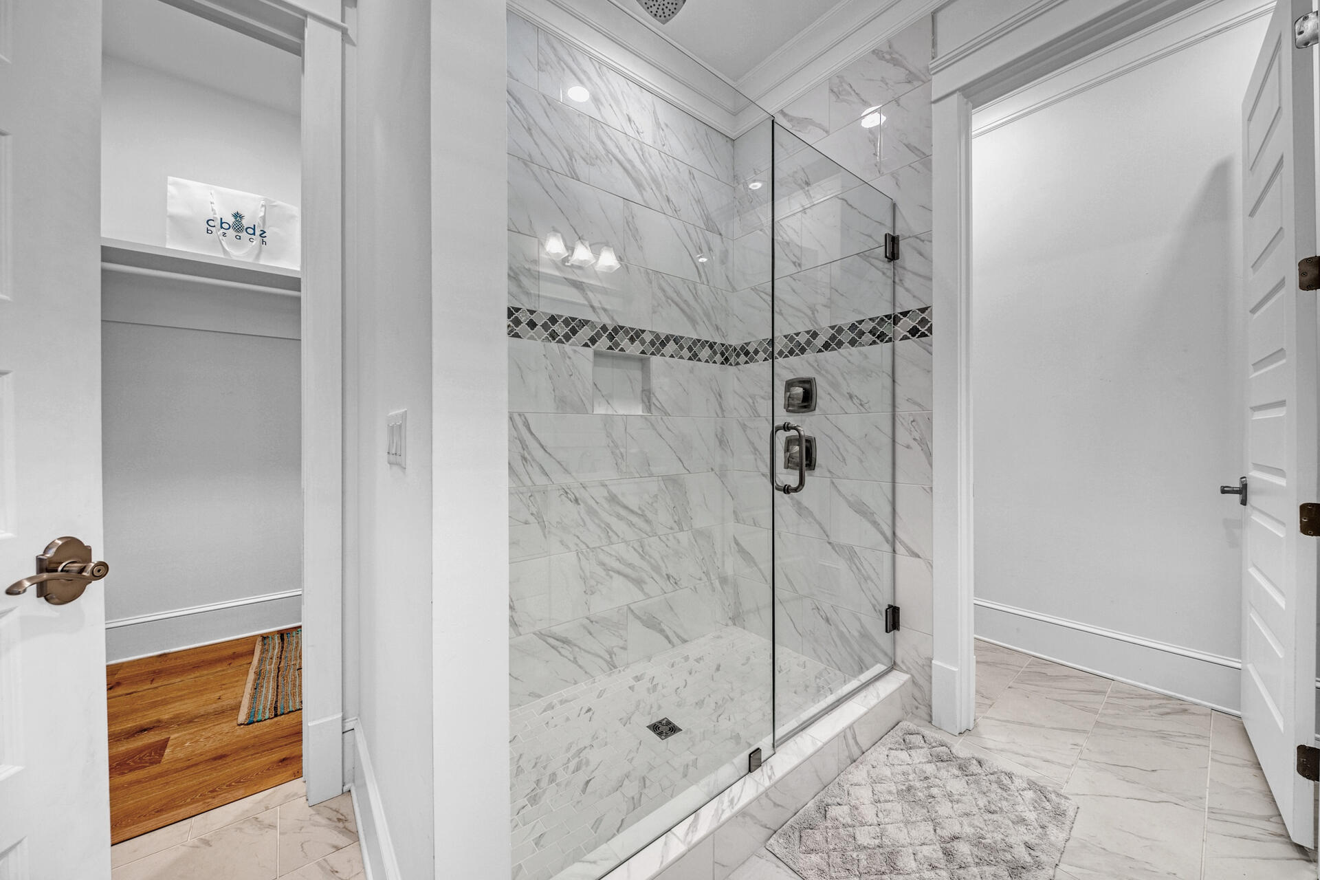 41 Clipper Street Inlet Beach, FL 32461 - Photo 22 of 48 a bathroom with a glass shower door