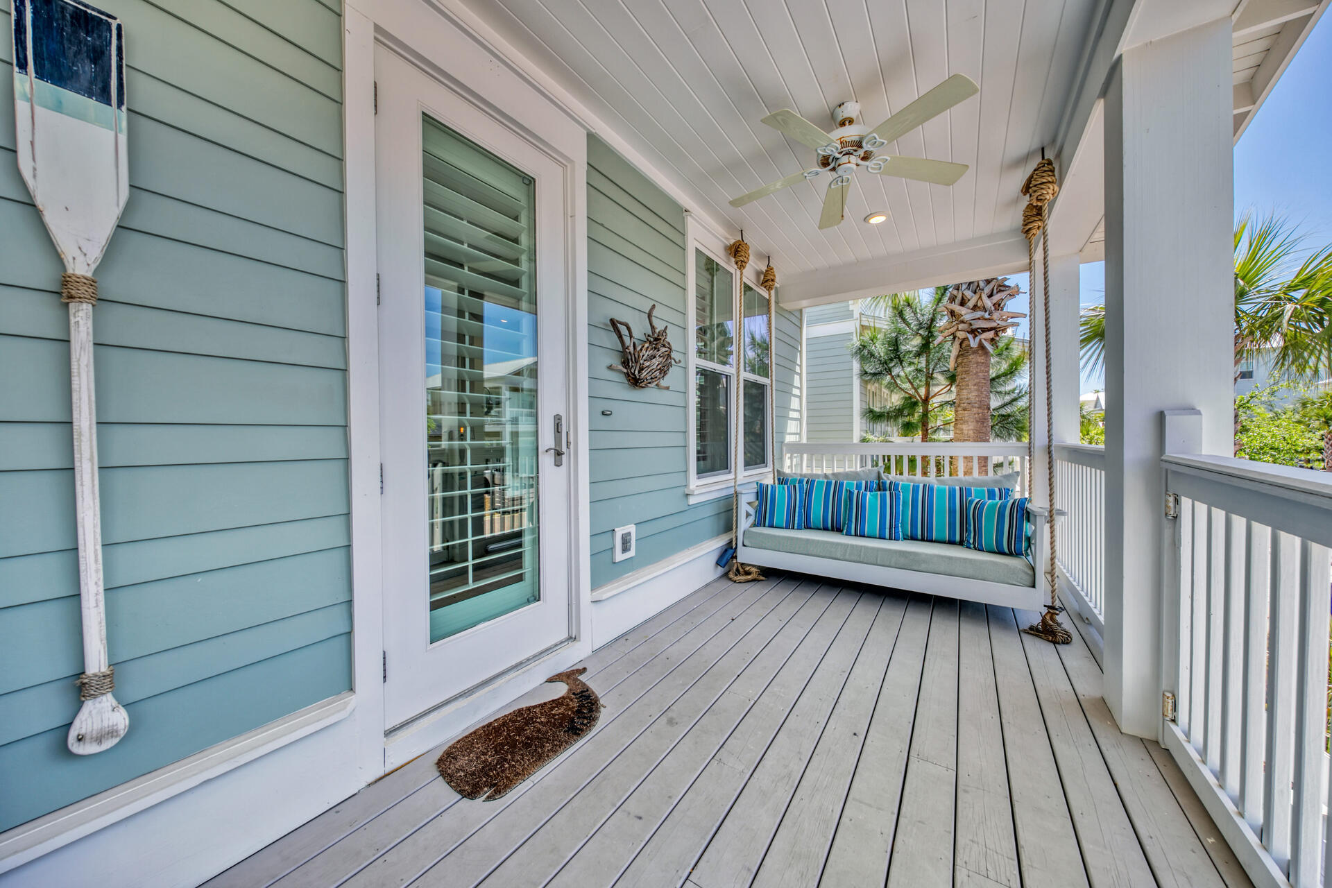 41 Clipper Street Inlet Beach, FL 32461 - Photo 3 of 48 a view of a balcony with a floor to ceiling window with wooden floor