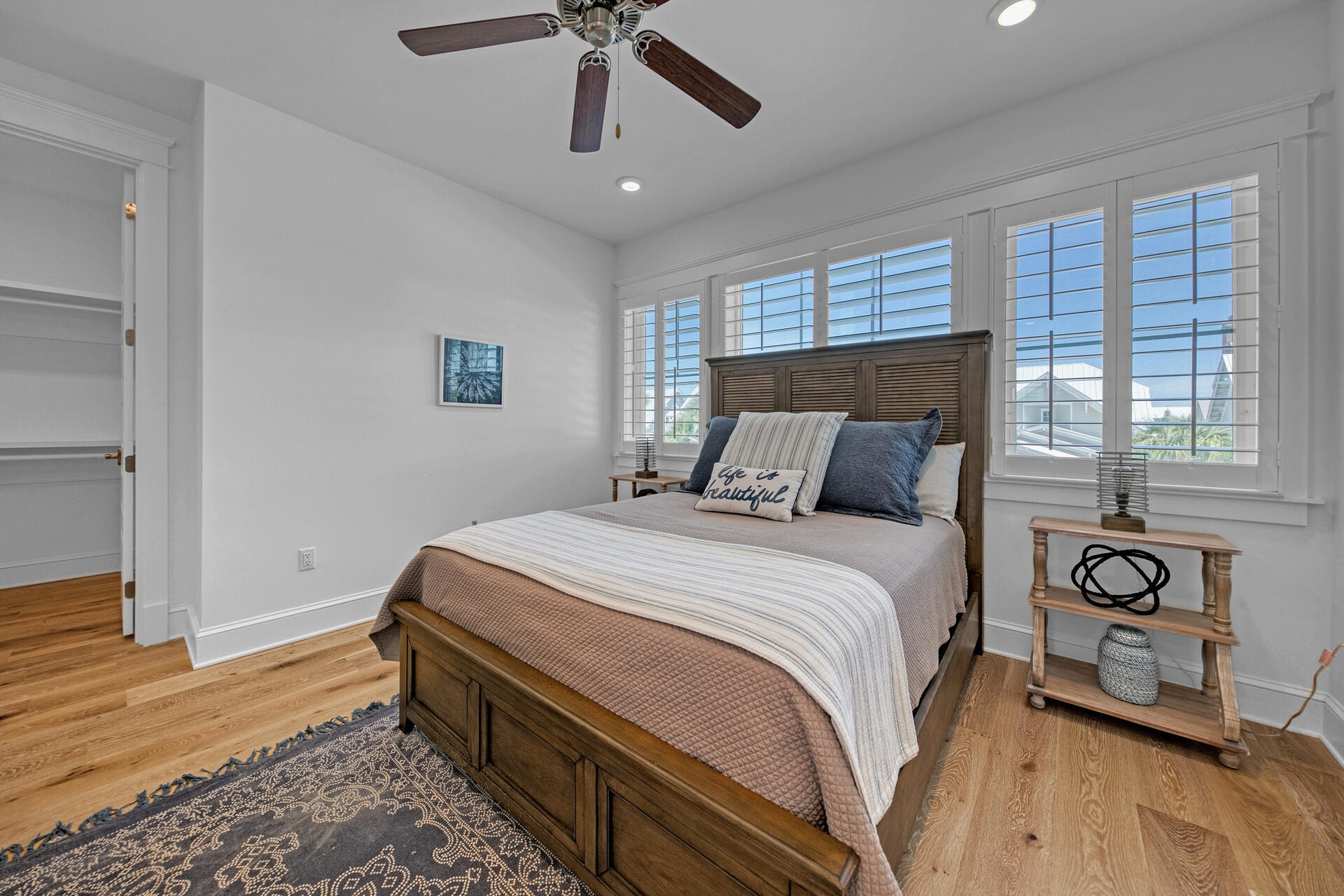 41 Clipper Street Inlet Beach, FL 32461 - Photo 32 of 48 a bedroom with a bed and wooden floor