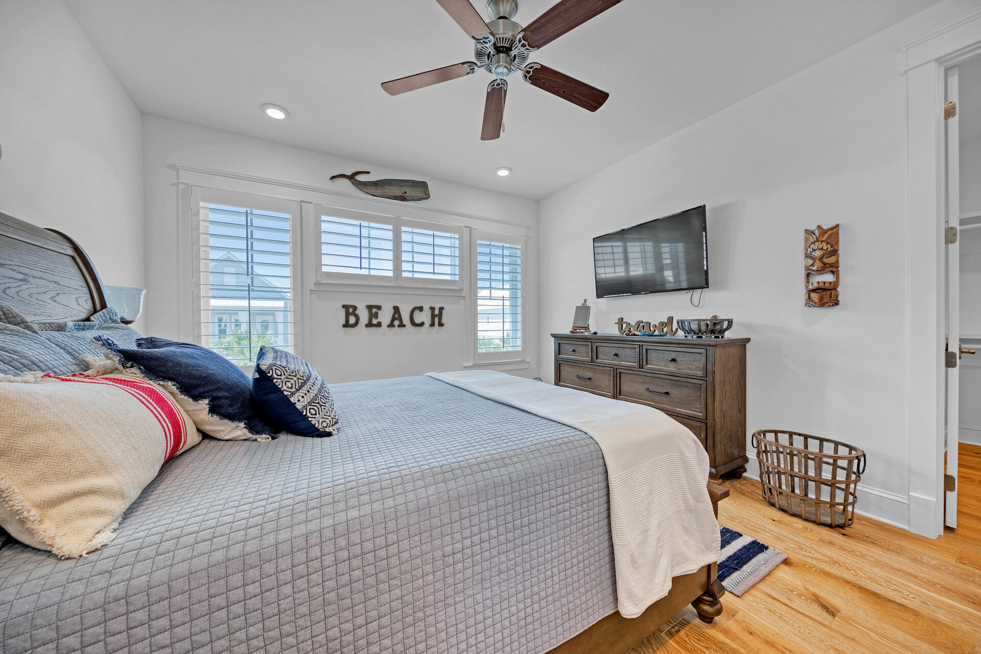 41 Clipper Street Inlet Beach, FL 32461 - Photo 39 of 48 a bedroom with a bed dresser and a flat screen tv