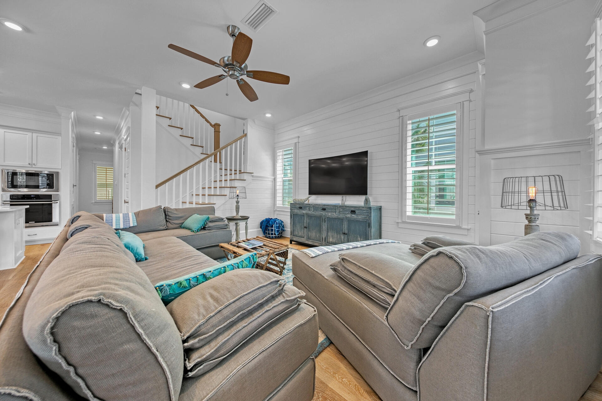 41 Clipper Street Inlet Beach, FL 32461 - Photo 5 of 48 a living room with furniture a ceiling fan and a flat screen tv