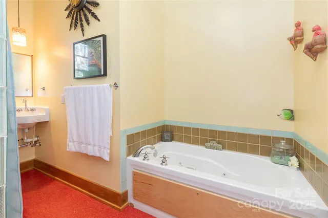 a bathroom with a bathtub and a shower