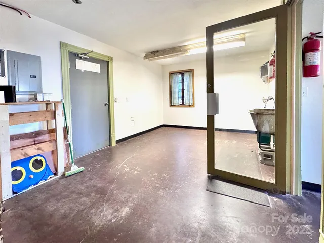 a view of an entryway with wooden floor
