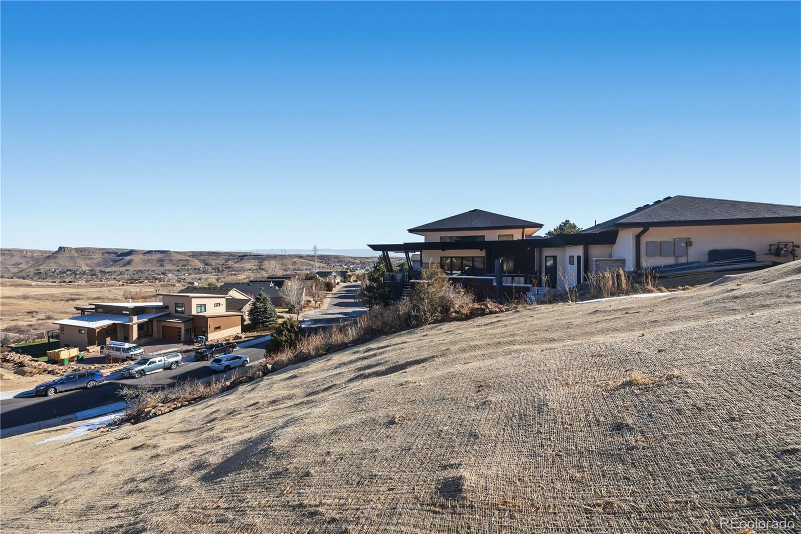 848 Shelton Road Golden, CO 80401 - Photo 4 of 13 a front view of a house with a yard and mountain view in back