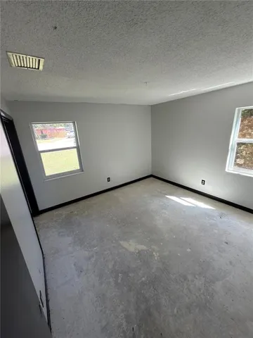 an empty room with windows