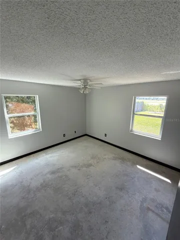 an empty room with windows